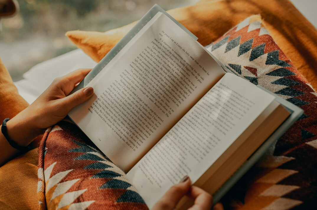 person reading mystery novel